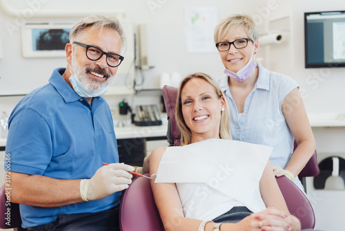 Smiling female patient posing with her dentist © contrastwerkstatt
