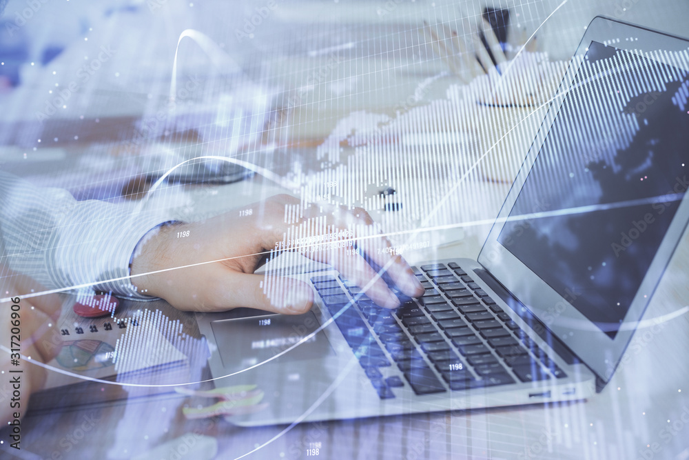 Double exposure of stock market graph with man working on laptop on background. Concept of financial analysis. Double exposure of stock market graph with man working on laptop on background. Concept of financial analysis.