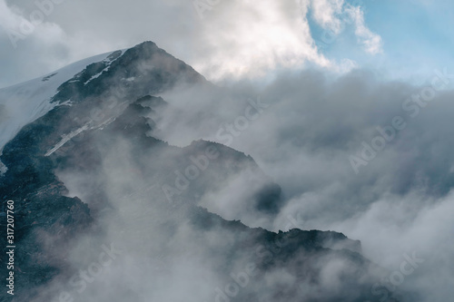 Dramatic cloudy high mountain landscape.