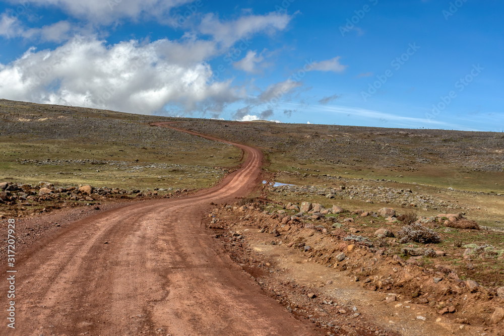 Naklejka premium Landscape with road to top of the Ethiopian Bale Mountains National Park. Ethiopia wilderness pure nature. Sunny day with blue sky.