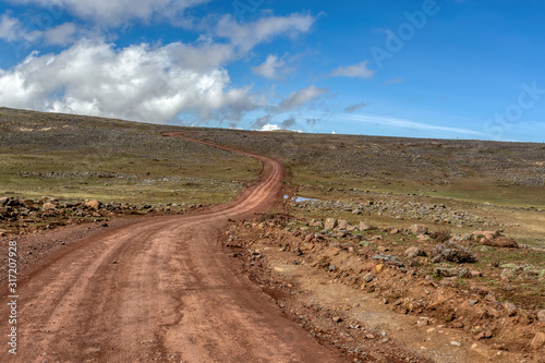 Landscape with road to top of the Ethiopian Bale Mountains National Park. Ethiopia wilderness pure nature. Sunny day with blue sky.