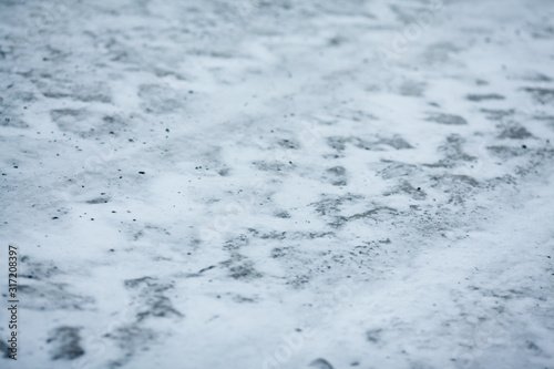 Tire tracks on dirty snow