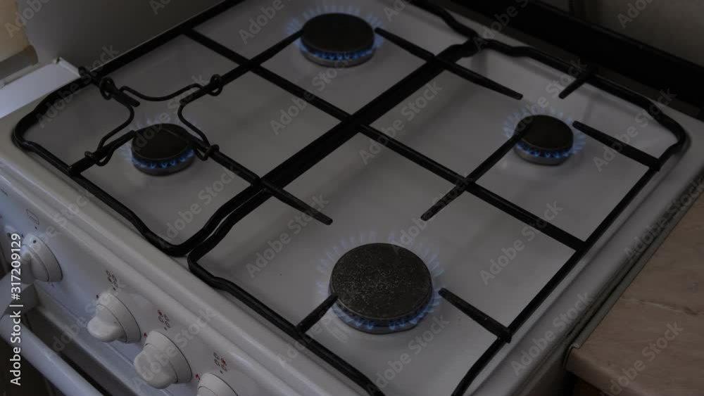 gas stove with burning burners gas stove with burning burners