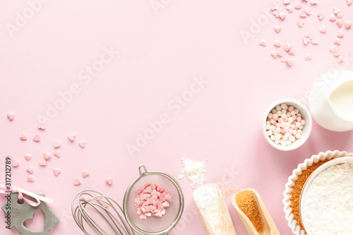 Fotografia, Obraz Frame of food ingredients for baking on a gently pink pastel background