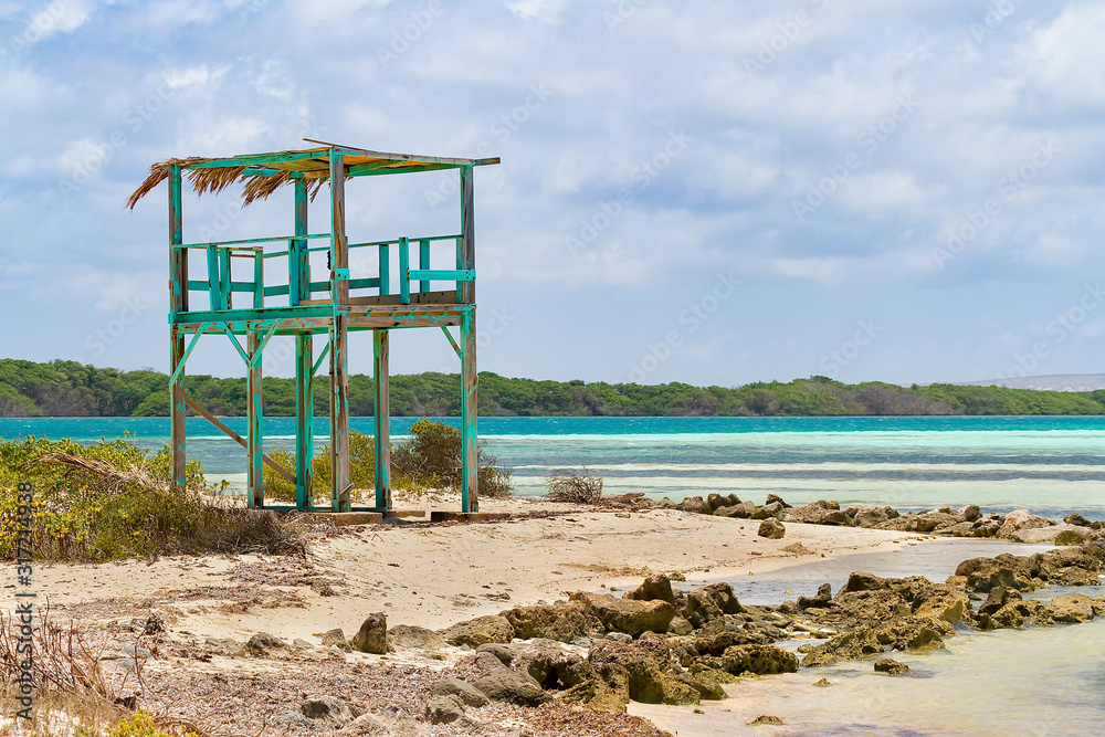 Lookout tower on beach next to the sea Lookout tower on beach next to the sea