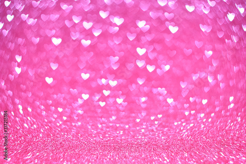 Abstract vintage background from glitter pink bokeh lights in the shape of a heart, blurred background
