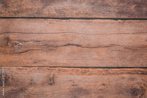 Light wooden background for photographs. Brown texture of a cut tree. Copyspace.