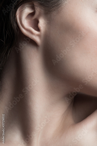 part of young woman neck and face closeup natural beauty care concept