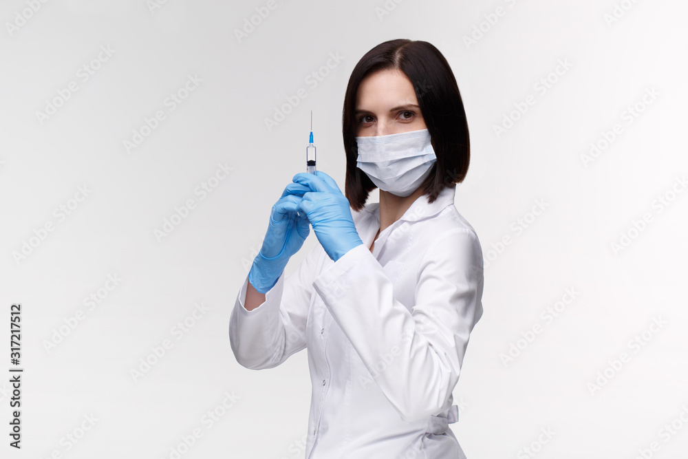 Medical injection,diseases,health care,science,diabetes.Doctor or nurse in hospital holding a syringe with liquid vaccines preparing to do an injection.Medical equipment. People in white uniform,robe. Medical injection,diseases,health care,science,diabetes.Doctor or nurse in hospital holding a syringe with liquid vaccines preparing to do an injection.Medical equipment. People in white uniform,robe.