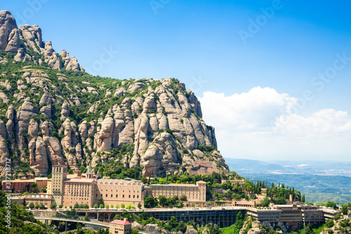 View of Montserrat Monastery on the mountain of Montserrat, Catalonia, Barcelona, Spain Sunny day, blue sky