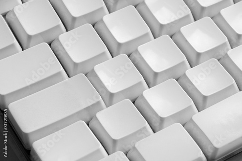 Close up shot of blank keys of white computer keyboard. © Aydn