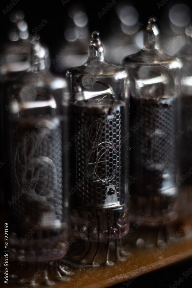 Nixie tubes IN-16 on a printed circuit board with electronic components Nixie tubes IN-16 on a printed circuit board with electronic components