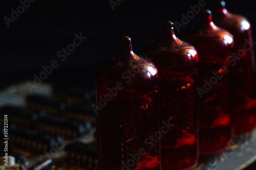 Nixie tubes on a printed circuit board with electronic components
