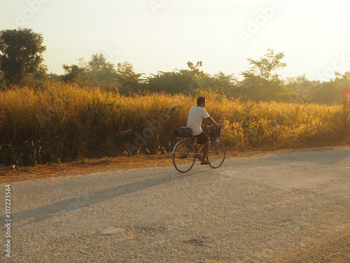 man riding a bike in park