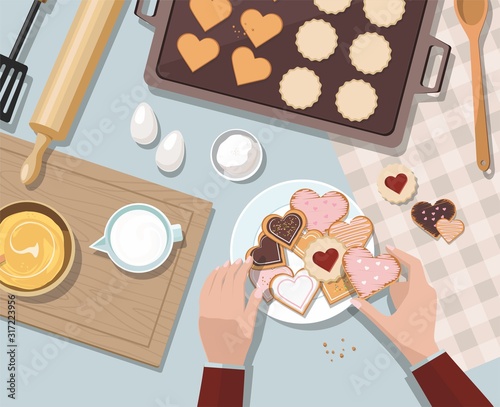 Woman baking. Baking utensils and cooking ingredients for tarts, cookies, dough and pastry. Valentine's day.