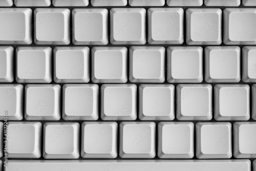 Close up shot of blank keys of white computer keyboard.