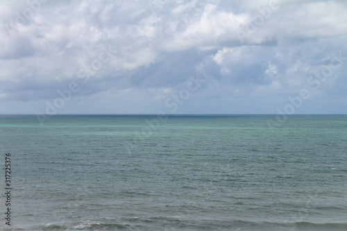 horizon line in the sea. storm clouds over ocean water.