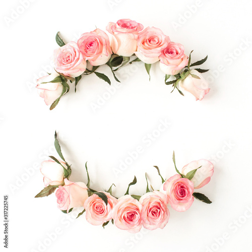 Round frame border of pink rose flower buds on white background. Mockup blank copy space. Flat lay, top view floral composition.
