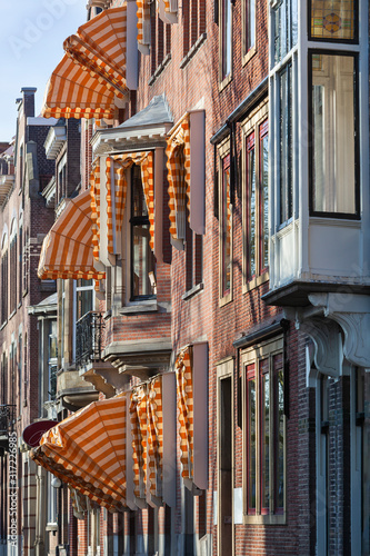 Nostalgic street with bay windows and awnings in Rotterdam in the Netherlands photo