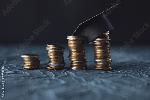 Scholarship money concept. Coins with money stack step growing growth saving money investment photo