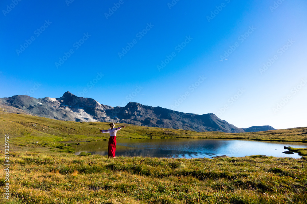 Young girl dancing in the mountains
