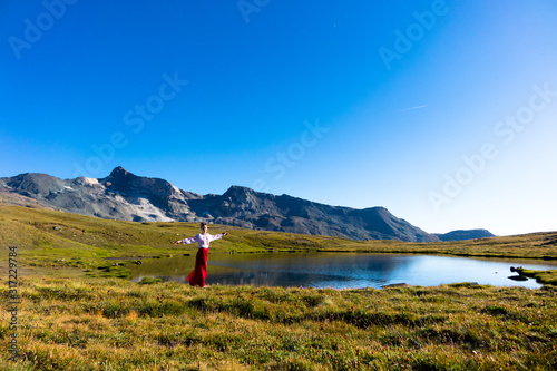 Young girl dancing in the mountains