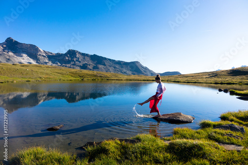 Young girl dancing in the mountains