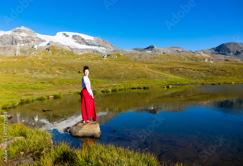 Young girl dancing in the mountains
