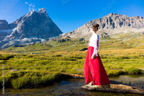 Young girl dancing in the mountains