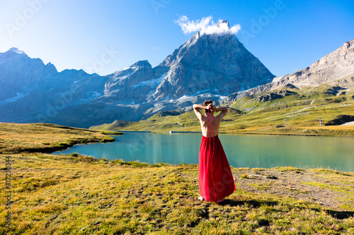 Young girl dancing in the mountains