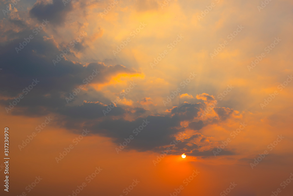 Beautiful sunset sky and clouds with dramatic light, Twilight sky background,Orange and red sky and light of the sun-Image Beautiful sunset sky and clouds with dramatic light, Twilight sky background,Orange and red sky and light of the sun-Image
