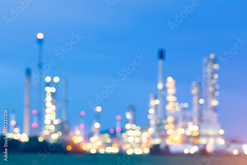 Abstract blur bokeh of oil gas refinery plant. May called petroleum, production or petrochemical plant. Industrial factory and engineering technology at night for business of power energy background. © DifferR