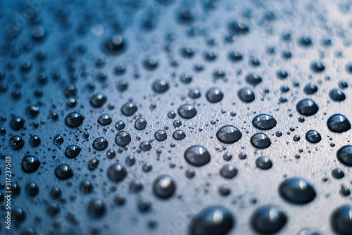 Water drops on plastic surface. Macro with shallow depth of field.