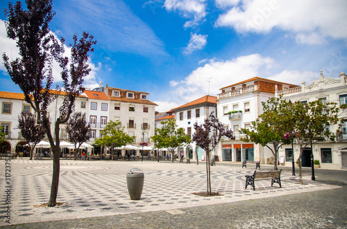 Portugal, view of the main square of the old town Leiria with red tile of roofs, paving portuguese streets, nice clear summer day with air blue sky in Portugal city