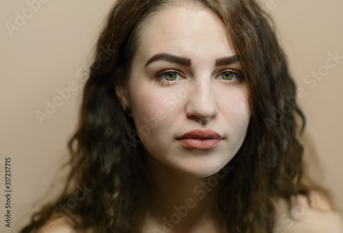 Portrait of beautiful emotional woman with green eyes. Studio shot.