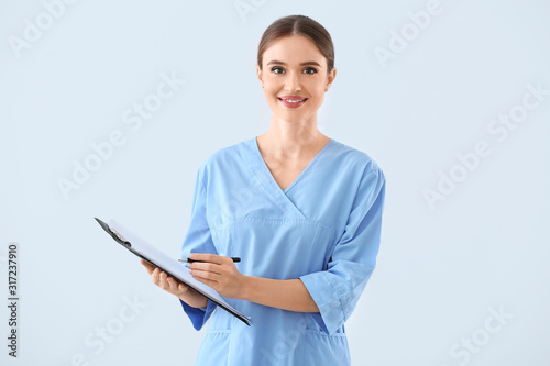 Portrait of female doctor w...