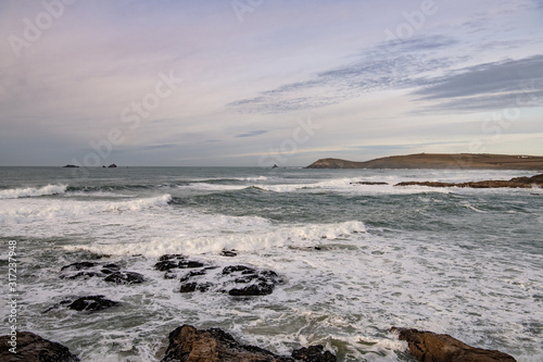 soft afternoon skies over waves and Cornish headland © Keith