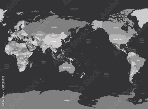 World map - Asia, Australia and Pacific Ocean centered. Grey colored on dark background. High detailed political map of World with country, capital, ocean and sea names labeling