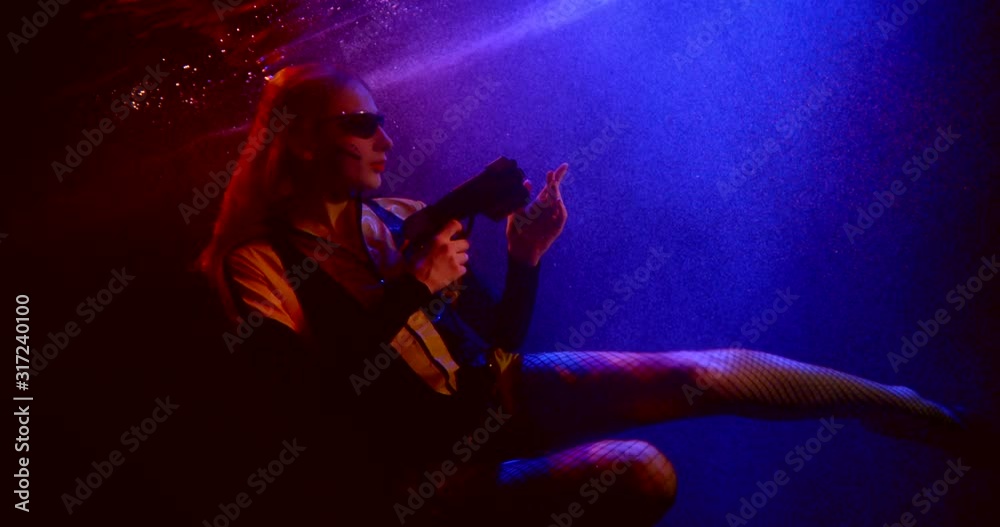 cyberpunk model with modern black glasses and gun underwater cyberpunk model with modern black glasses and gun underwater