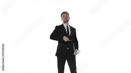 Businessman throws money on a white background