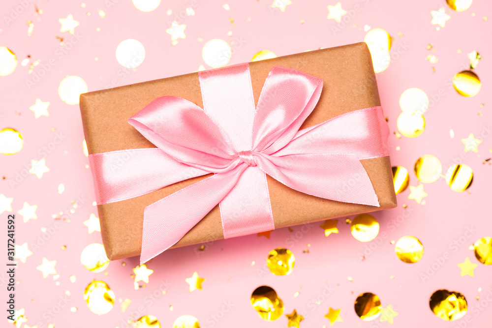 Christmas background with purple balls and present gift box and decoration on pink background. Christmas background with purple balls and present gift box and decoration on pink background.