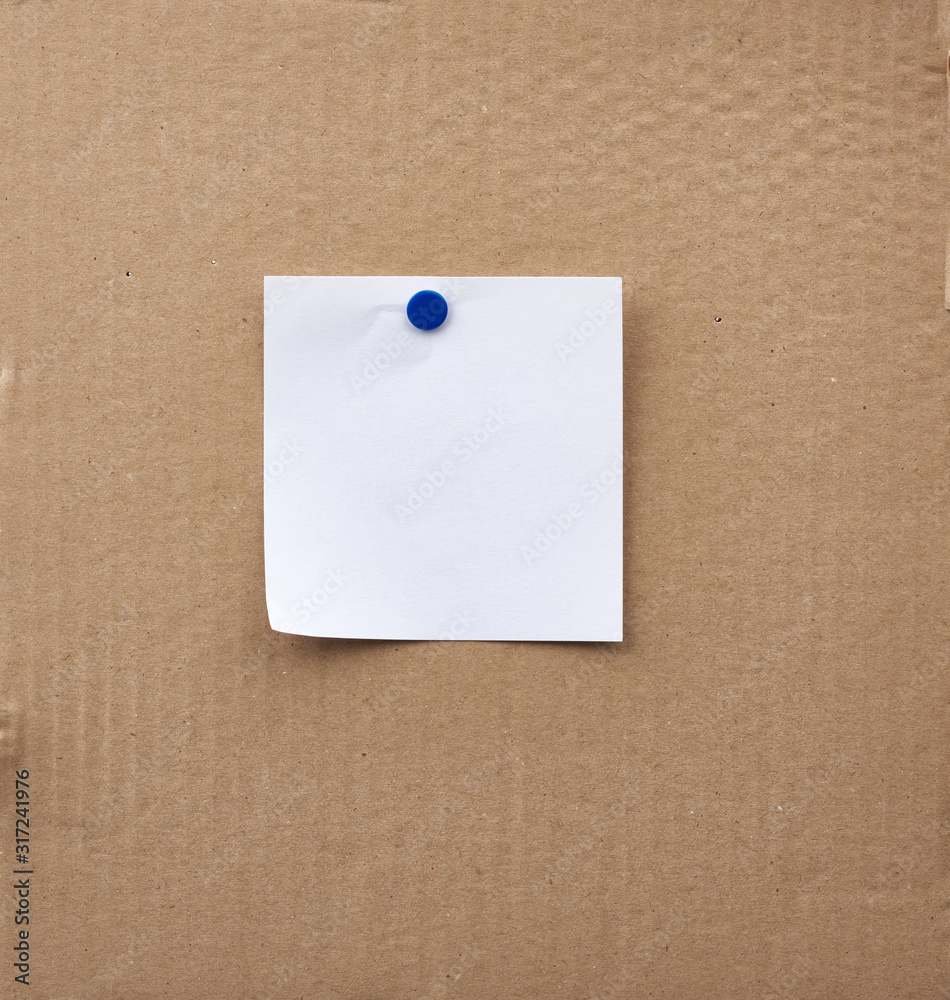 blank square white sheet of paper attached with an iron button