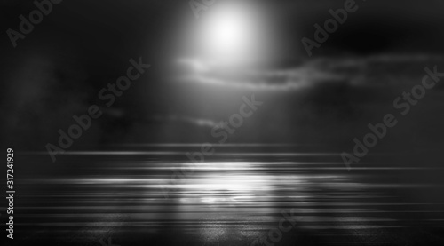 Dramatic black and white background. Cloudy night sky, moonlight, reflection on the pavement. Smoke and fog on a dark street at night.