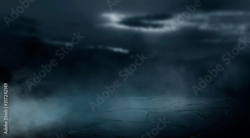 Dramatic black and white background. Cloudy night sky, moonlight, reflection on the pavement. Smoke and fog on a dark street at night.