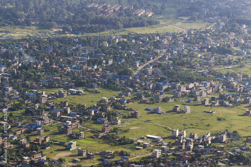 aerial view of the city settlement. Small houses and green glades