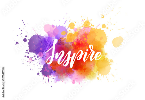 Inspire handwritten message on watercolor splash