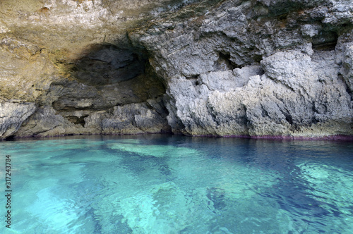 Cave in the sea of Lampedusa island, Sicily, Italy photo