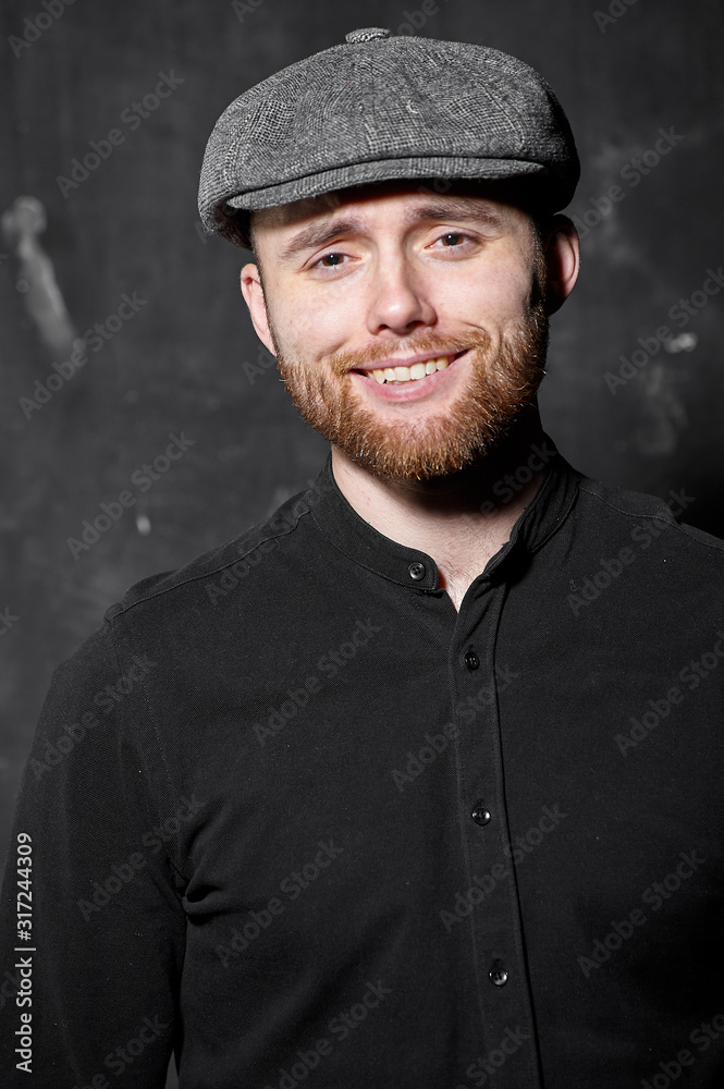 Portrait of happy handsome bearded man in studio Portrait of happy handsome bearded man in studio