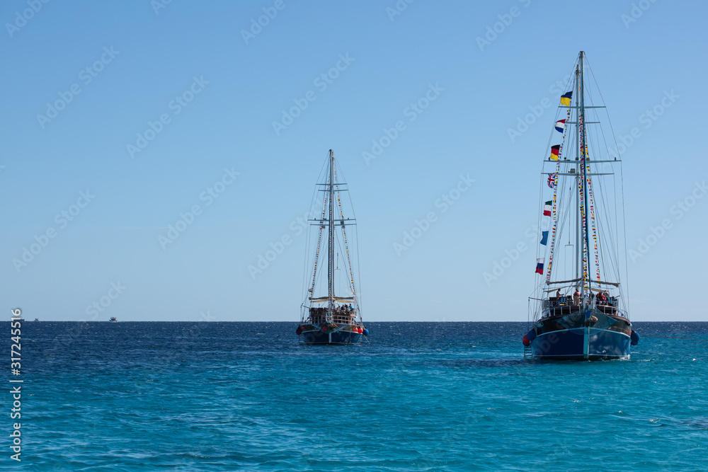 Two big ships with high masts sailing in the Red Sea Two big ships with high masts sailing in the Red Sea