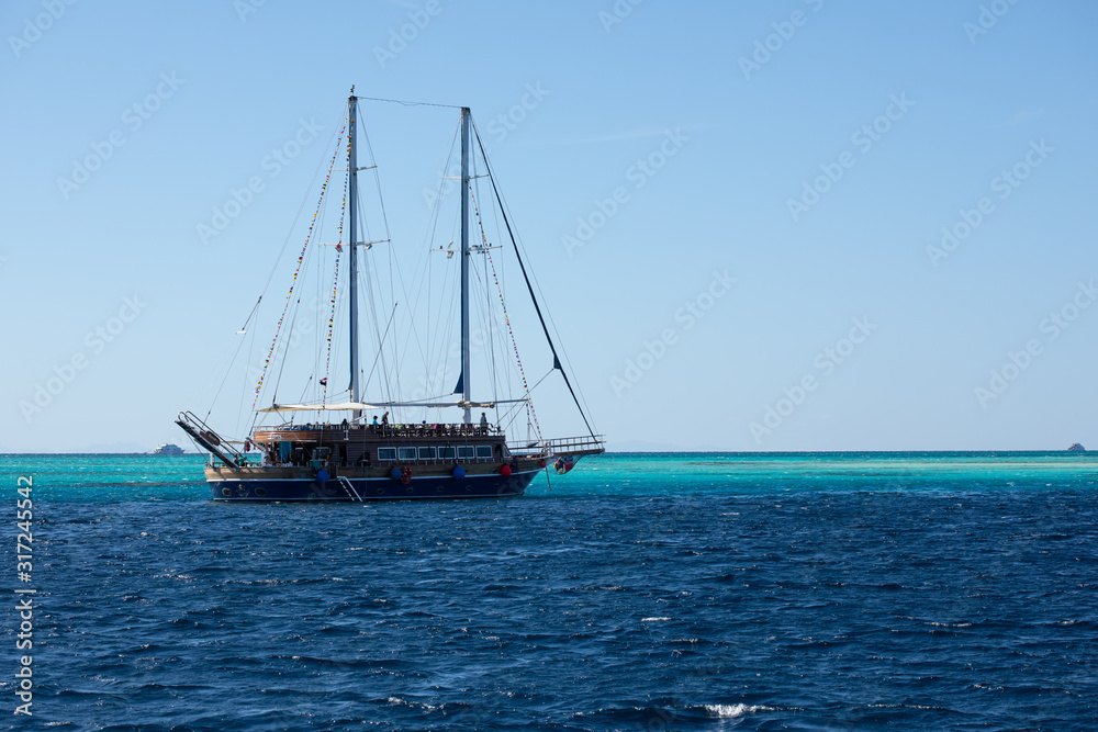 Big ship with masts sailing in the Red Sea Big ship with masts sailing in the Red Sea
